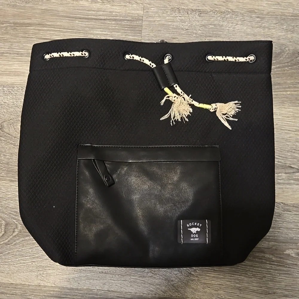 NWT Rocket Dog black backpack with zip top and striped lining.